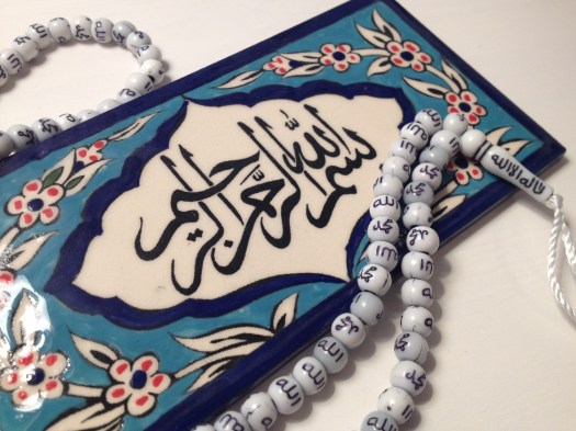 'In the name of God, the Most Compassionate, the Most Merciful.' Tile: painted by Armenian Christians in Jerusalem. Prayer beads: Downtown Amman.